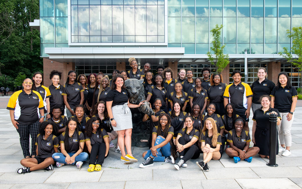 New Student and Family Programs Staff and Students at the tiger statue