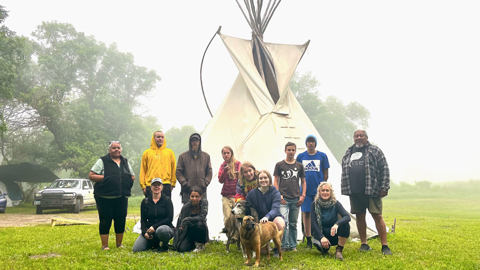 Josie Stahl and Tavia La Follette with Lakota Tribe members