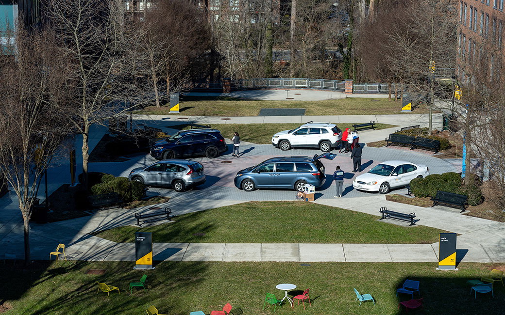 Quad from above with cars unloading