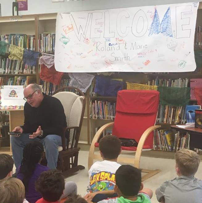 Author Roland Smith talks with fifth graders at Rodgers Forge Elementary School as part of his TUAA-sponsored visit to Towson