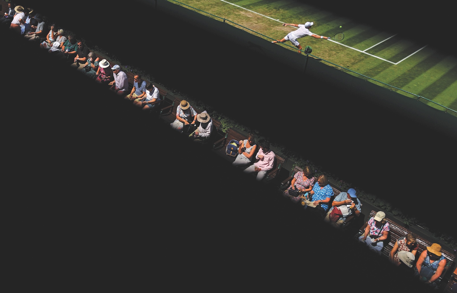 Crowd and player at Wimbledon separated by black lines