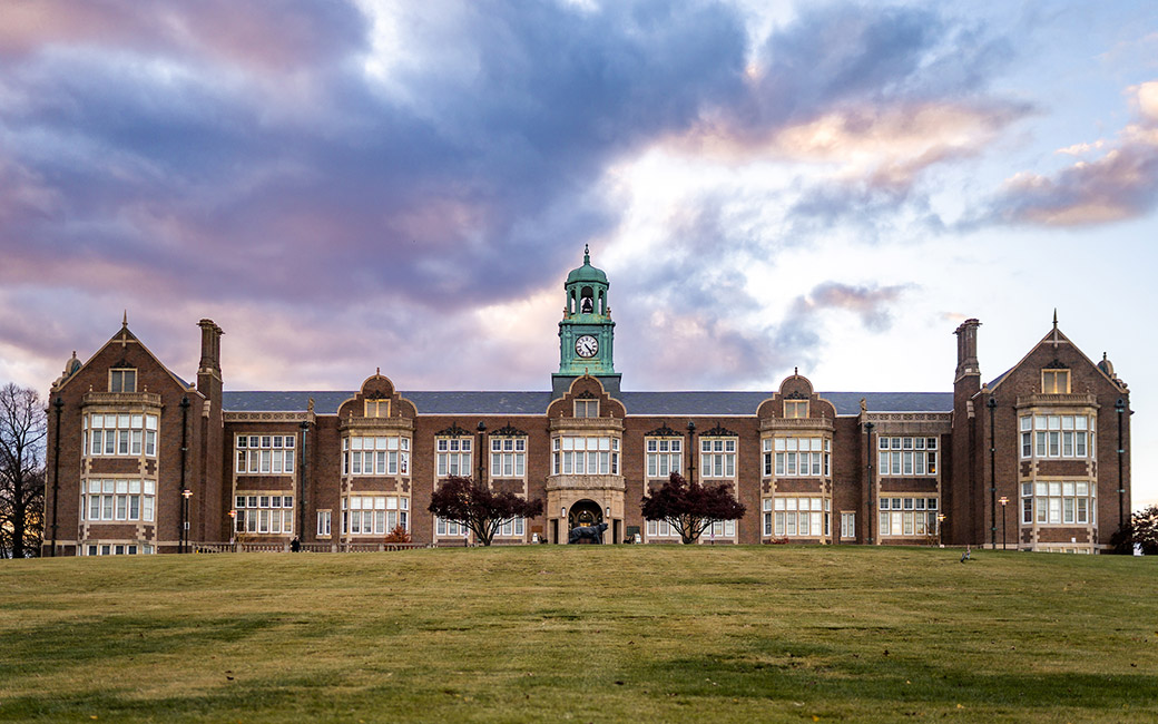 Building at sunset with colorful clouds