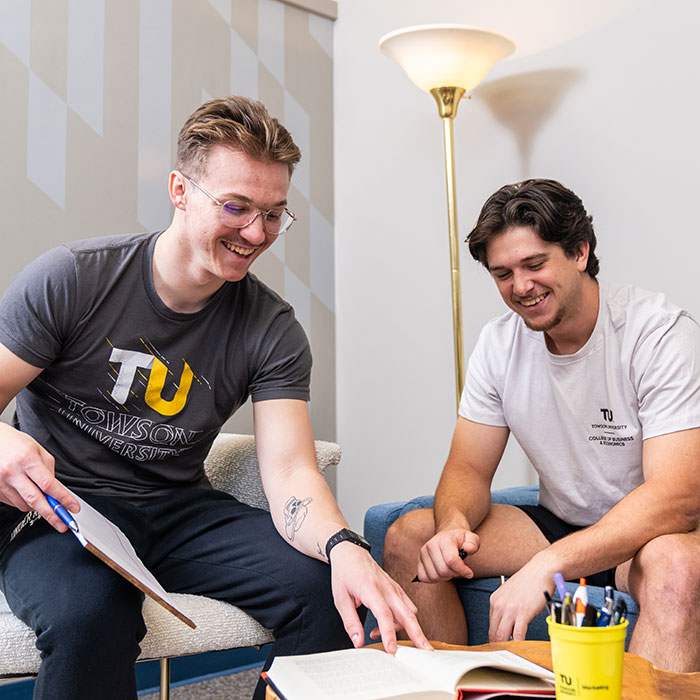 two students working together at a table