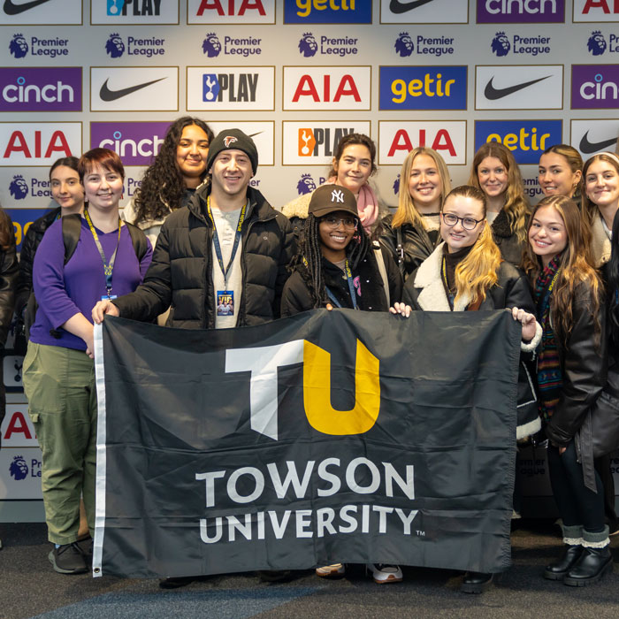 Tigers hold a TU flag on a study abroad minimester program to London