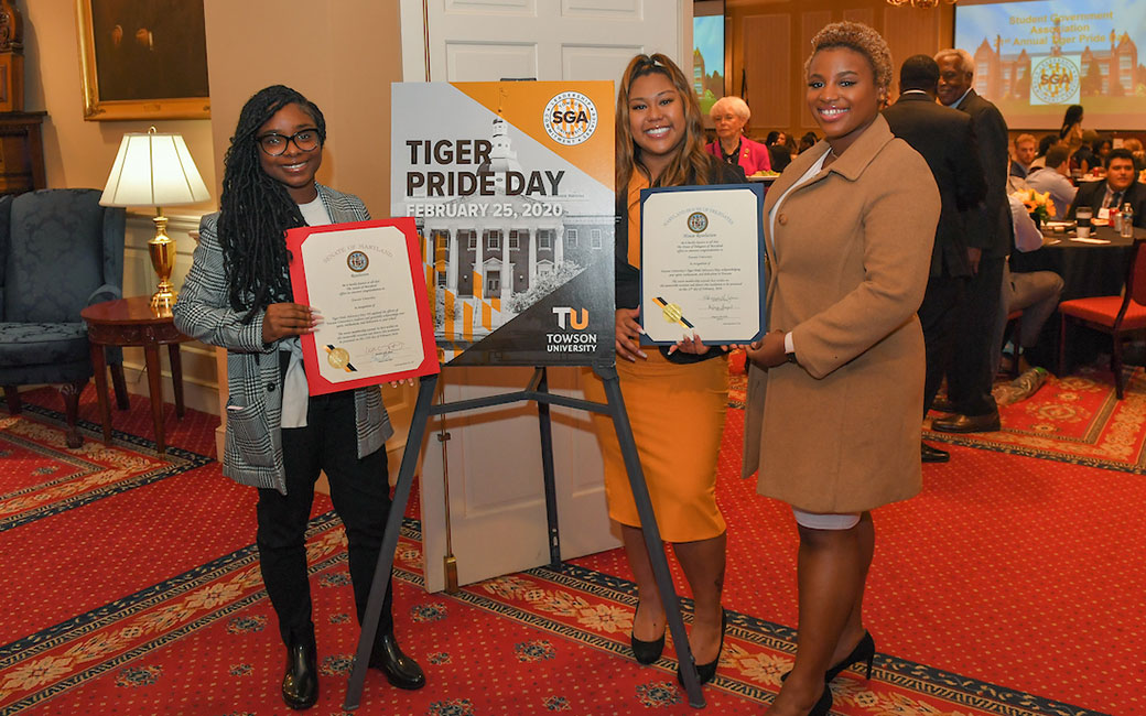 Members of SGA pose in front of the Tiger Pride Day sign