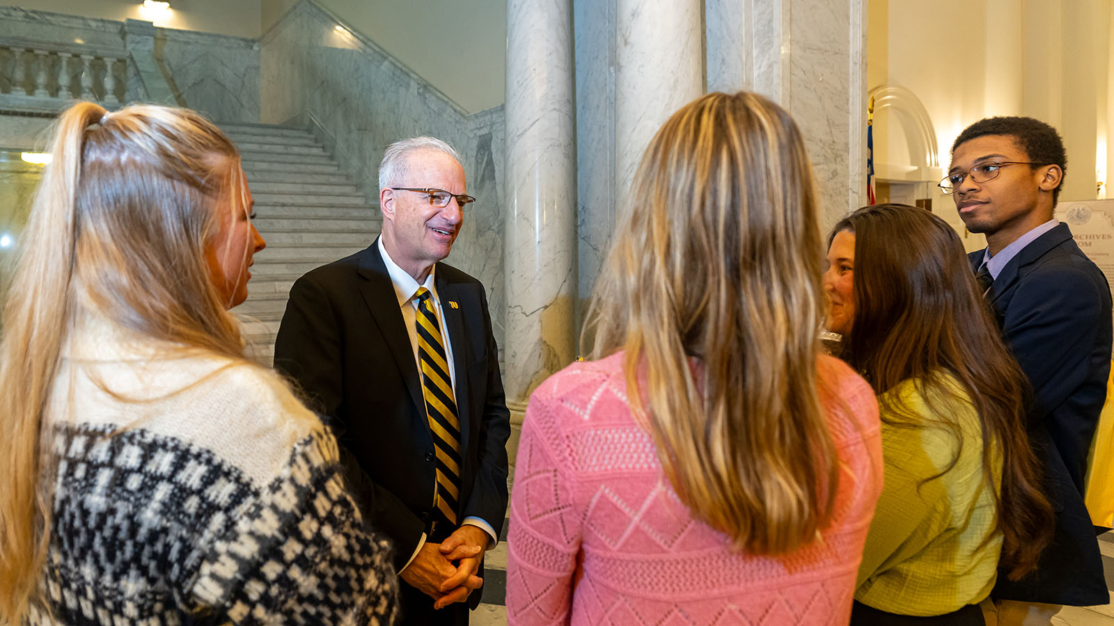 President Ginsberg with students on Tiger Pride Day