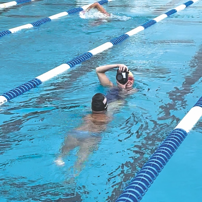 Madison taking photos in the pool