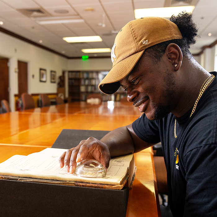 Student researching in the university archives