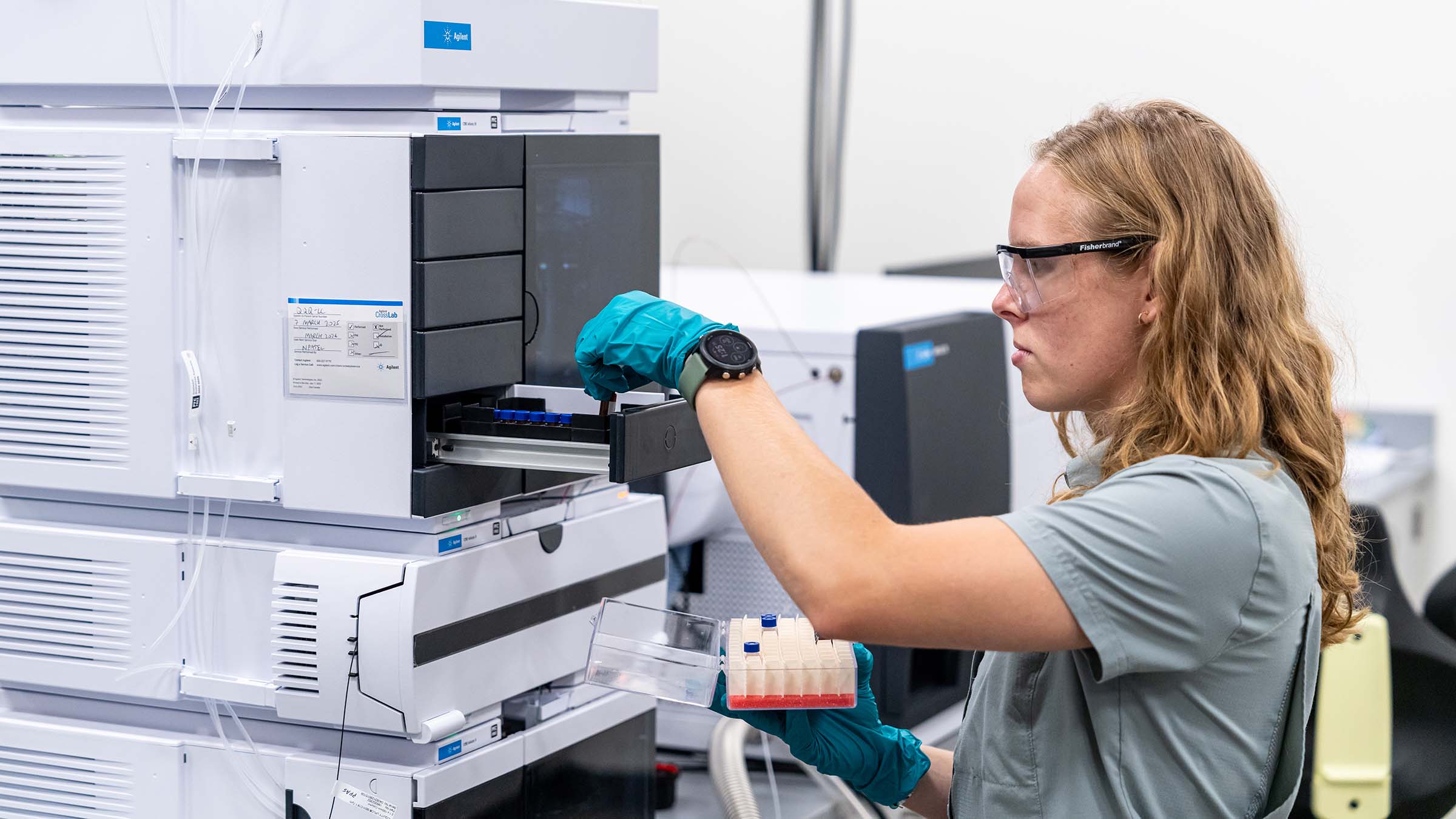 Student researcher using research equipment