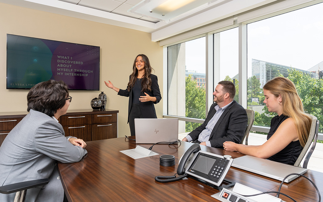 Student presenting to group at internship